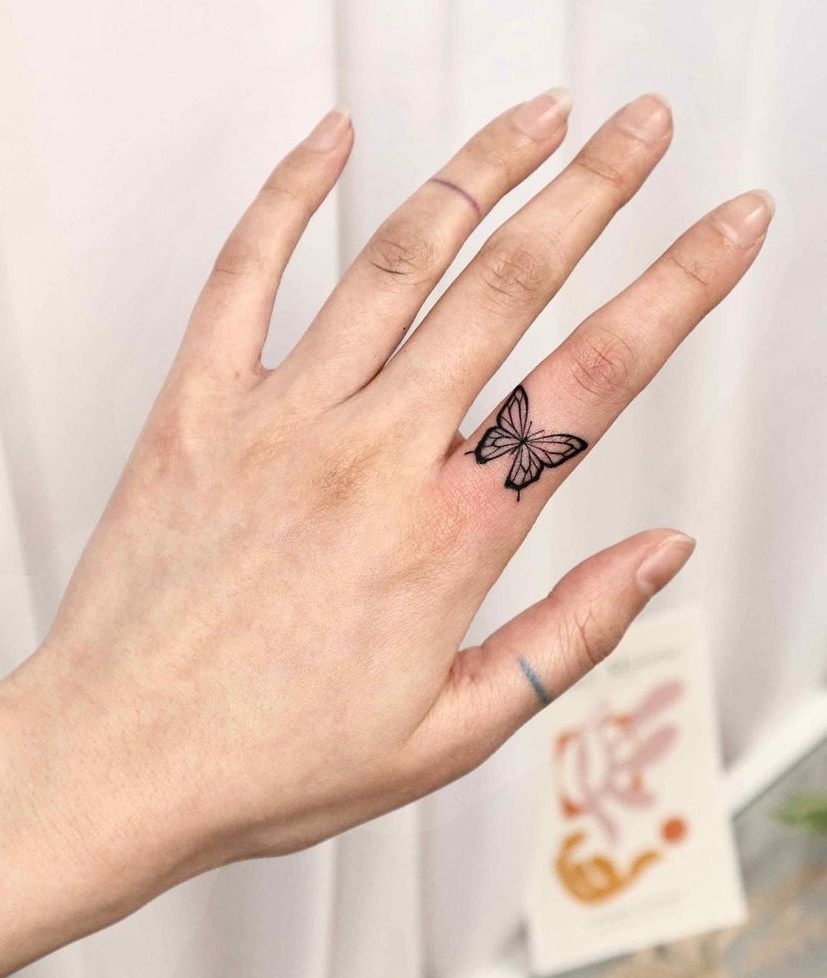 Black and White Butterfly Tattoo on Index Finger