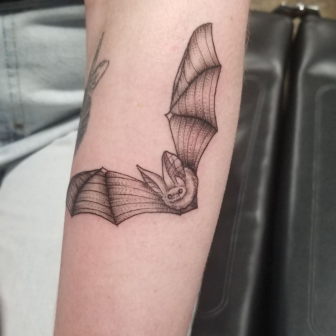 Mysterious Minimalist Bat Tattoo