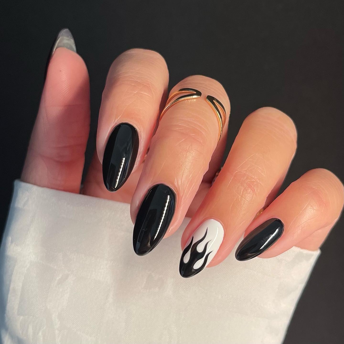 Short Round Black Nails with Flame Design on Ring Finger
