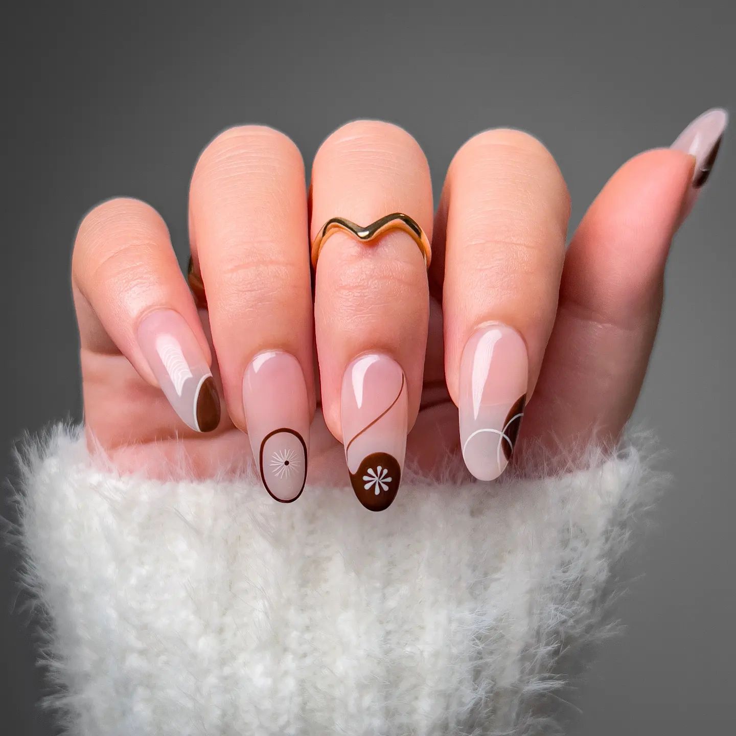 Round Clear Gel Nails with Brown Polish Design