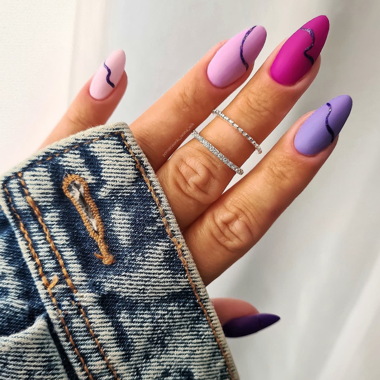 Round Pink and Purple Nails with Black Lines