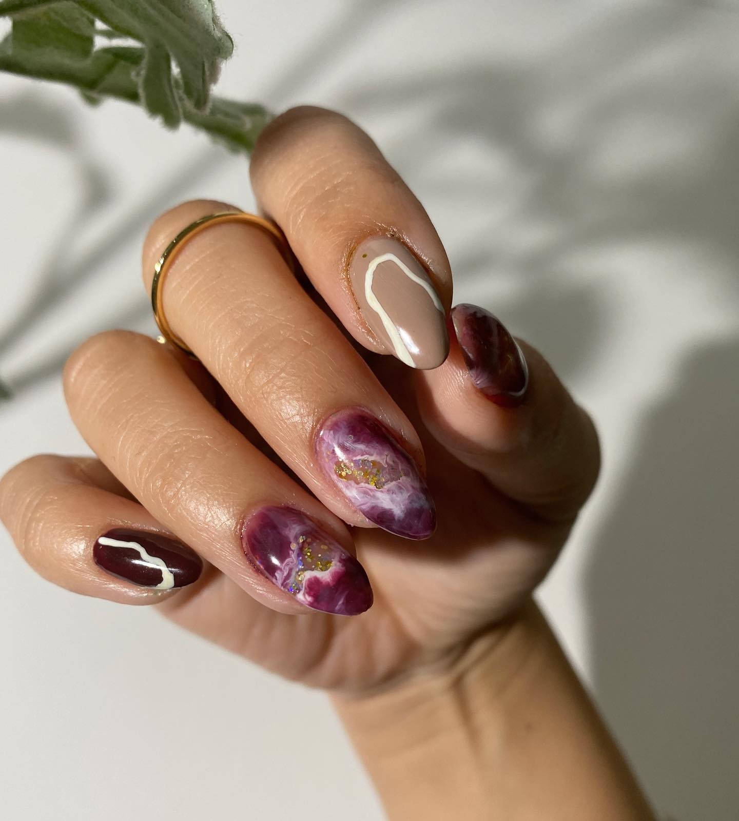 Short Almond Burgundy Nails with Marble Design