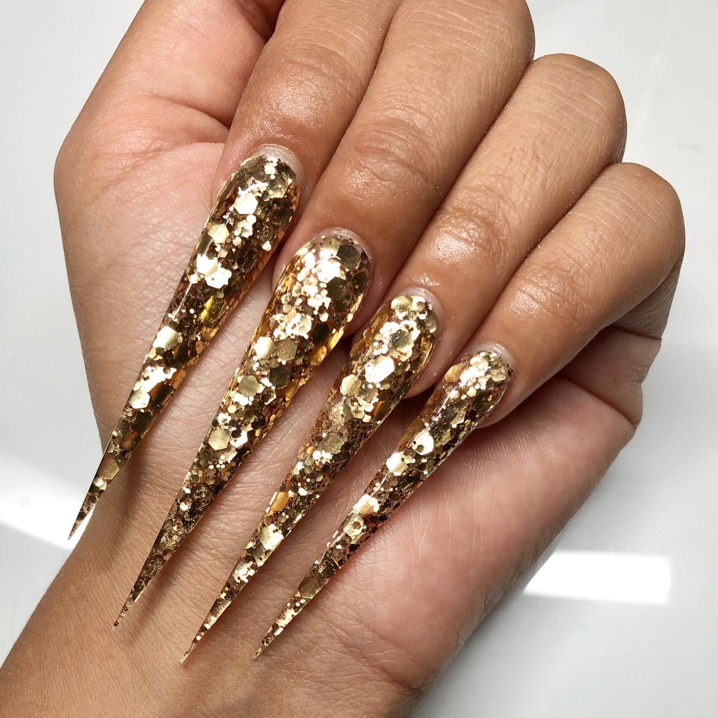 Very Long Stiletto Nails with Gold Glitter