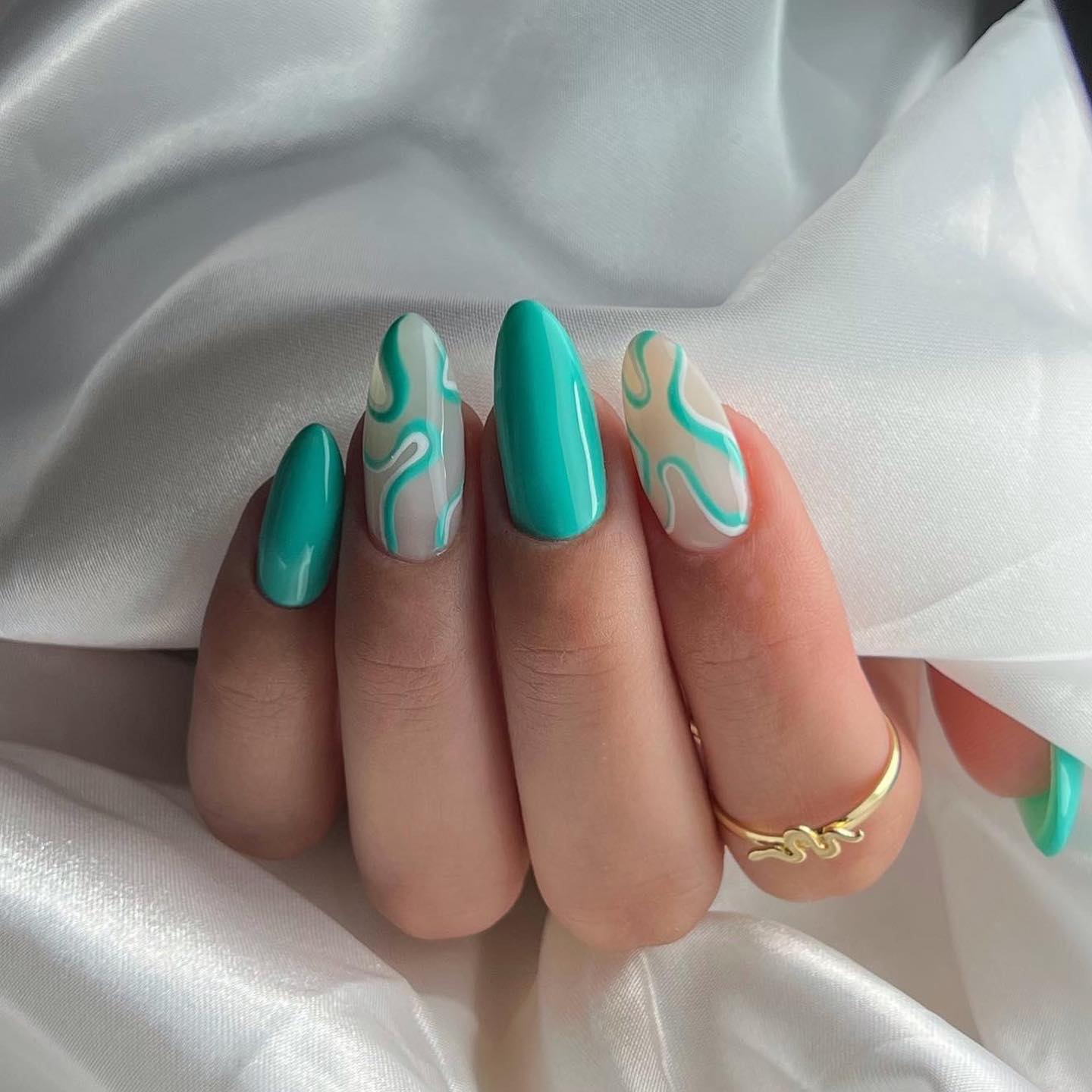 Green Almond Acrylic Nails with Abstract Lines