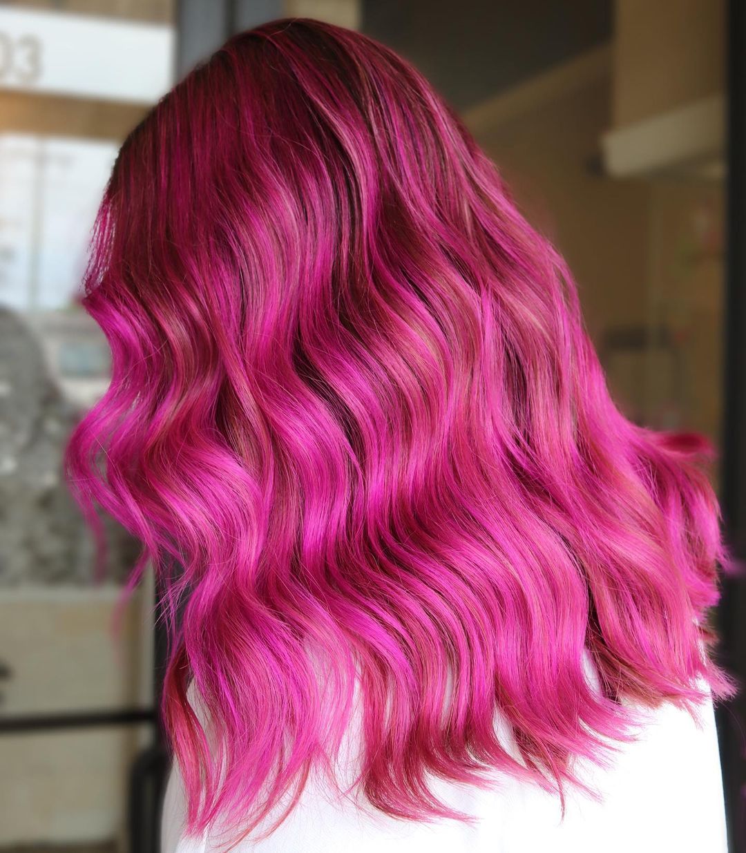 Hot Pink Medium-Length Hair with Dark Roots