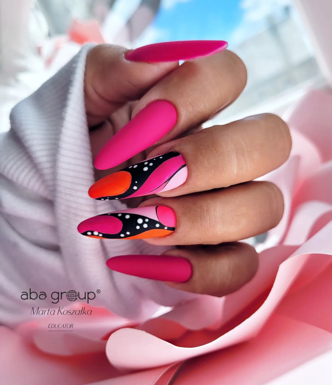 Long Pink Acrylic Nails with Abstract Design