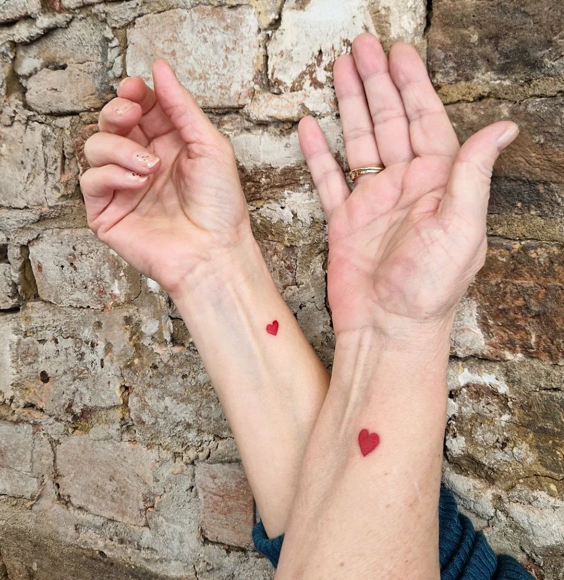 Matching Mother-Daughter Small Red Heart Tattoos
