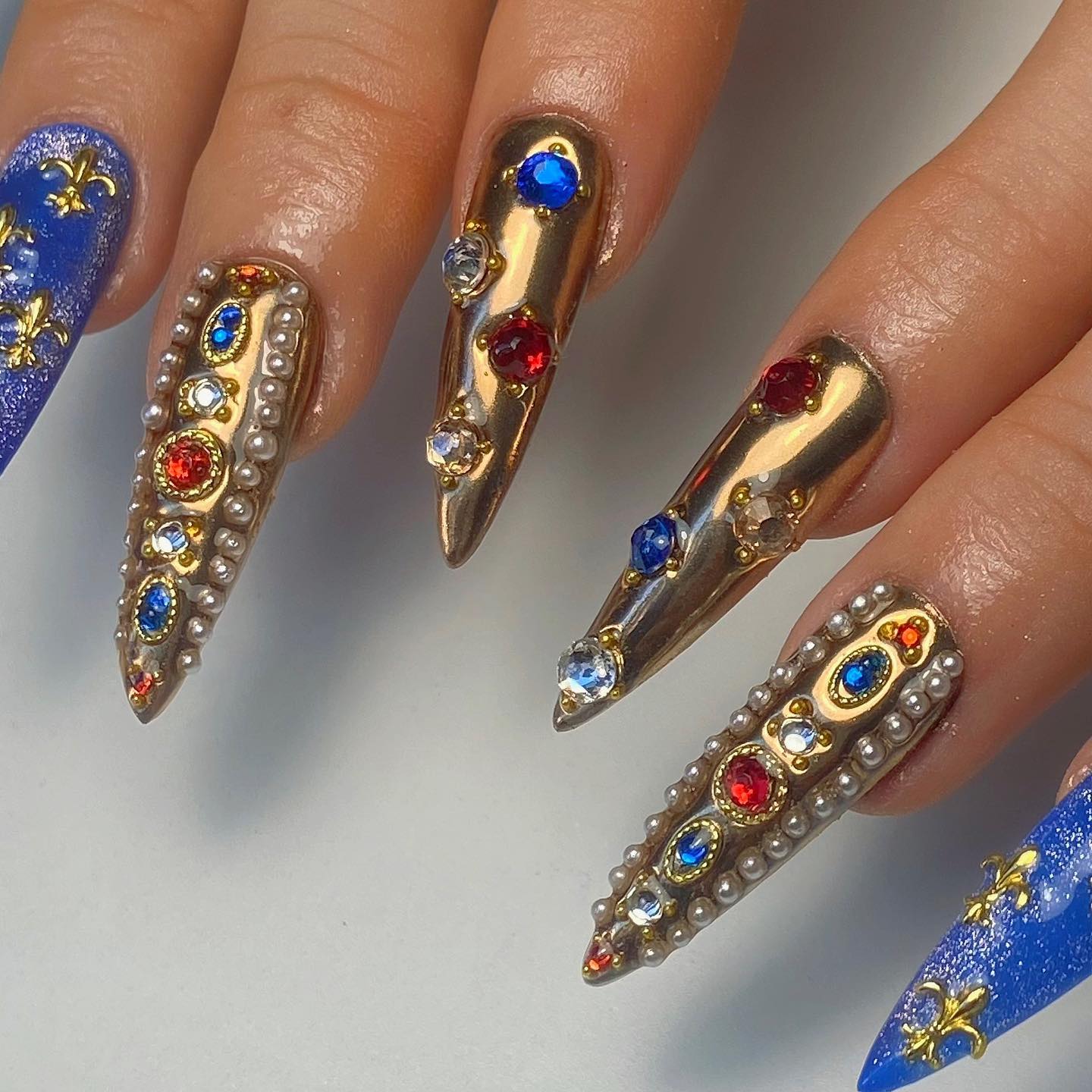 Gold Stiletto Nails with Colorful Rhinestones