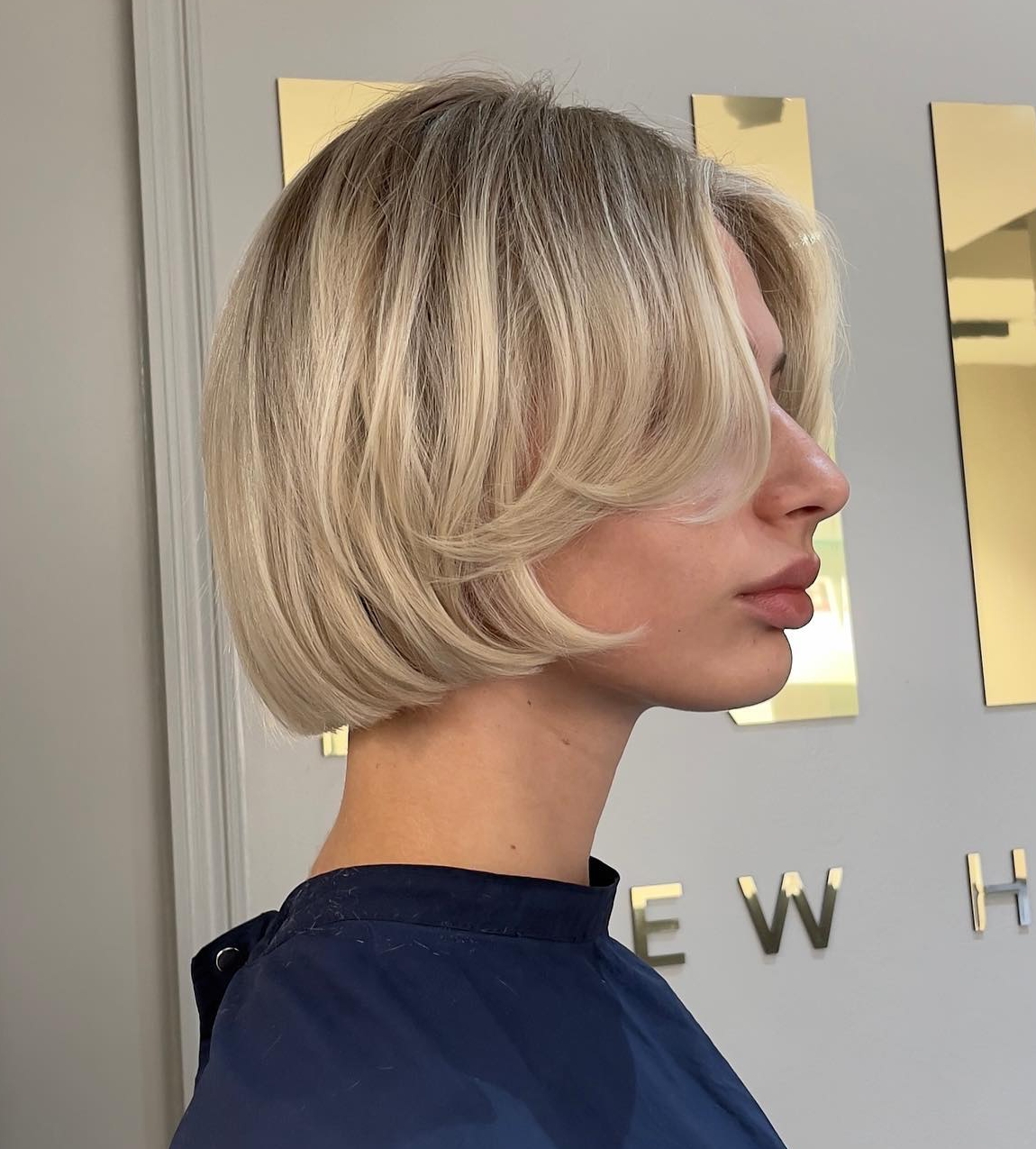 Short Bob Cut on Blonde Hair with Feathered Bang