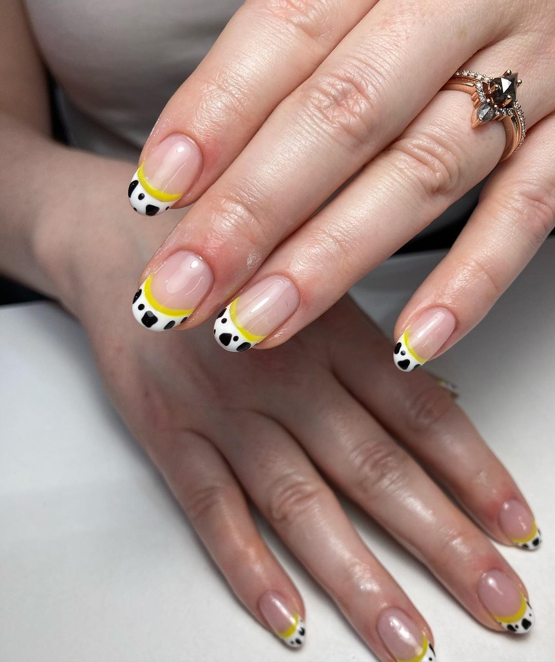 Short Round Nails with Yellow Cow Print Nail Tips