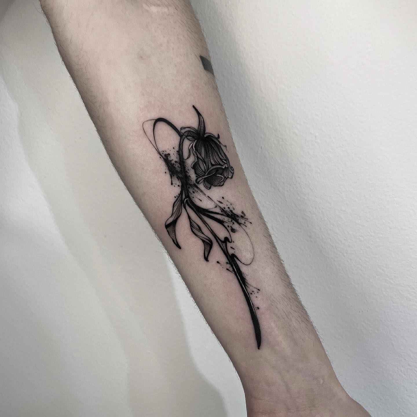 Black Dead Rose Tattoo on Arm