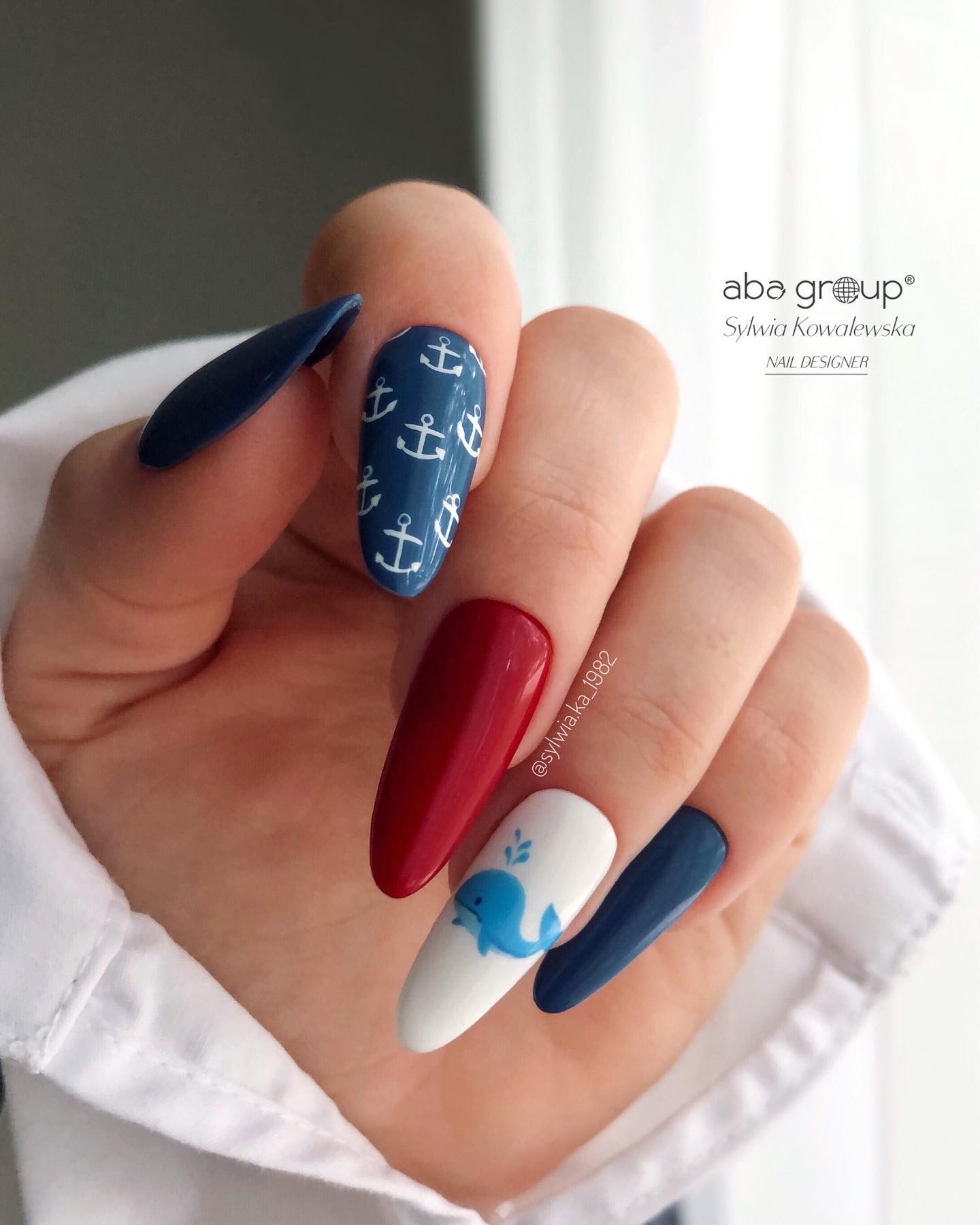Red and Blue Nails with White Design