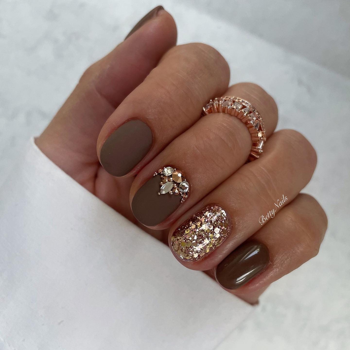 Short Matte Brown Nails with Gold Glitter