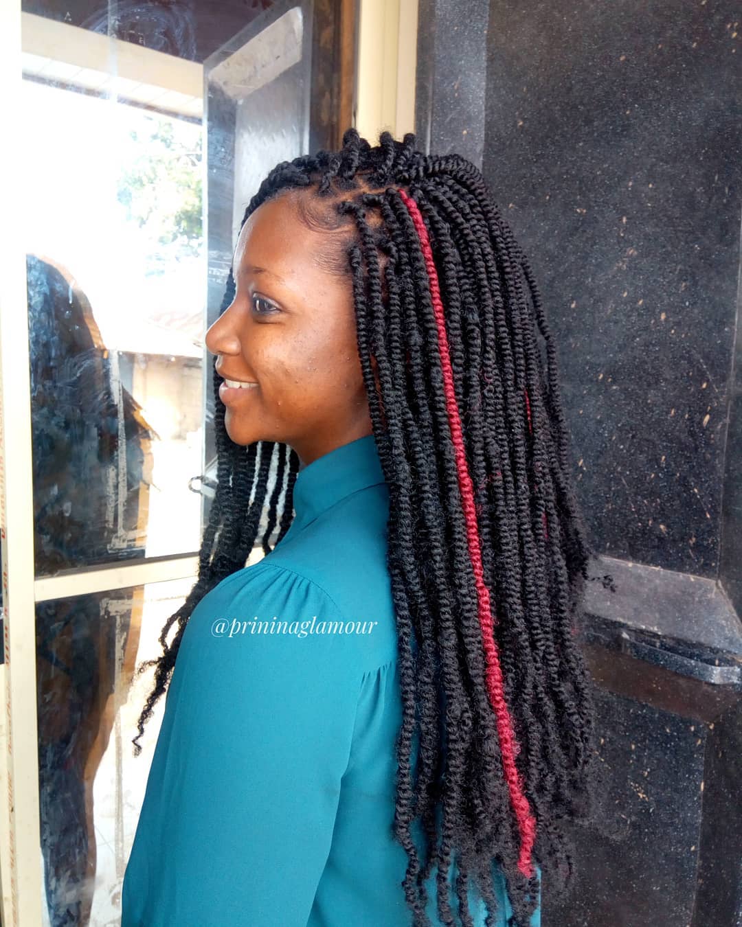 Nubian Twists on Long Black Hair with Red Strand