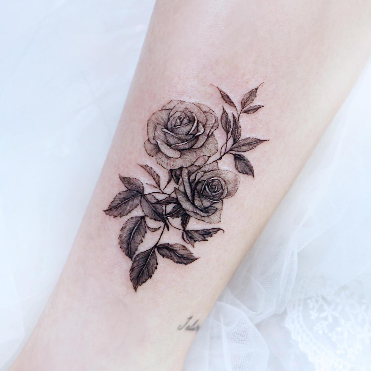 Black and White Rose Tattoo on Arm