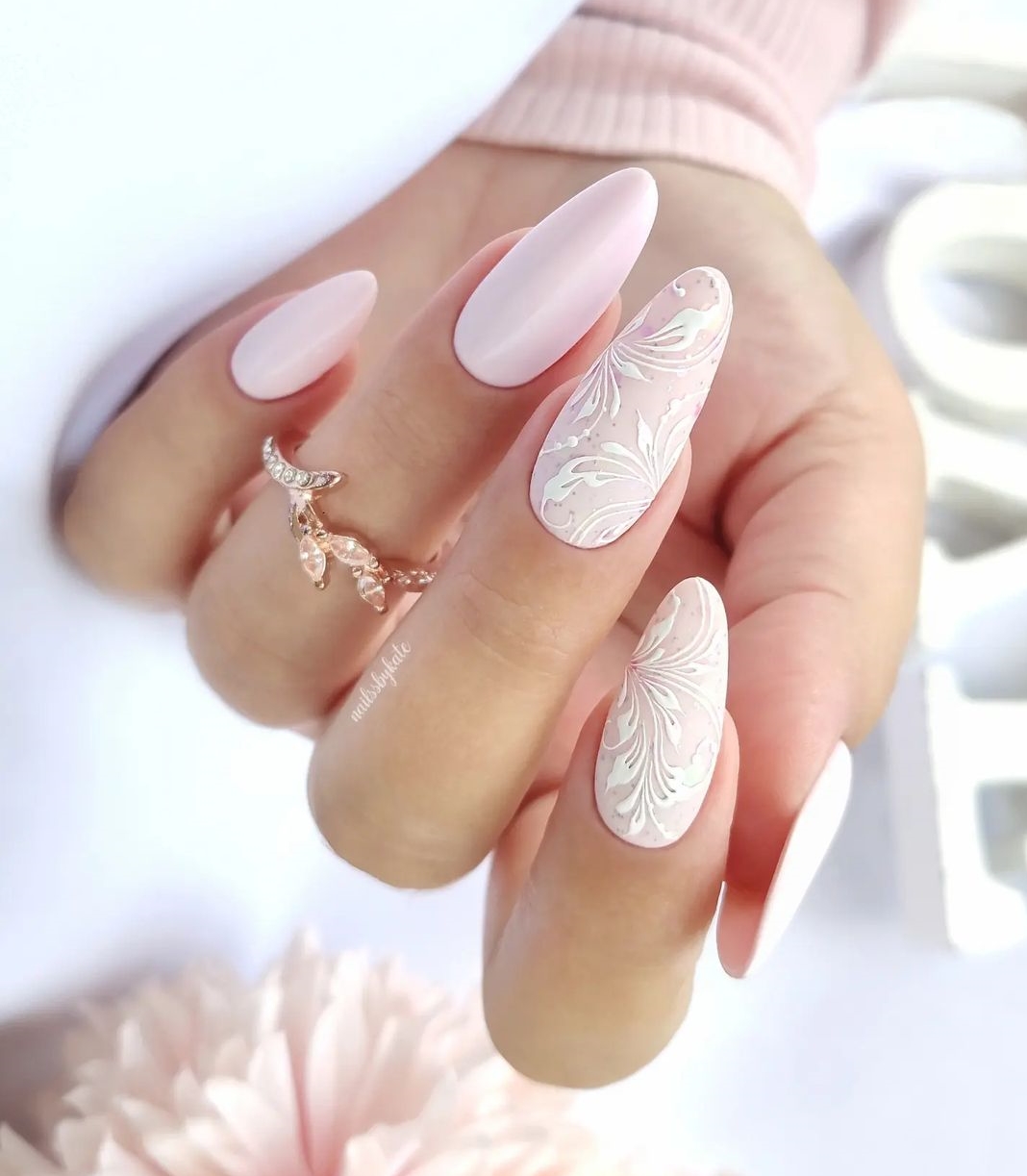 Light Pink Almond Nails with White Floral Design