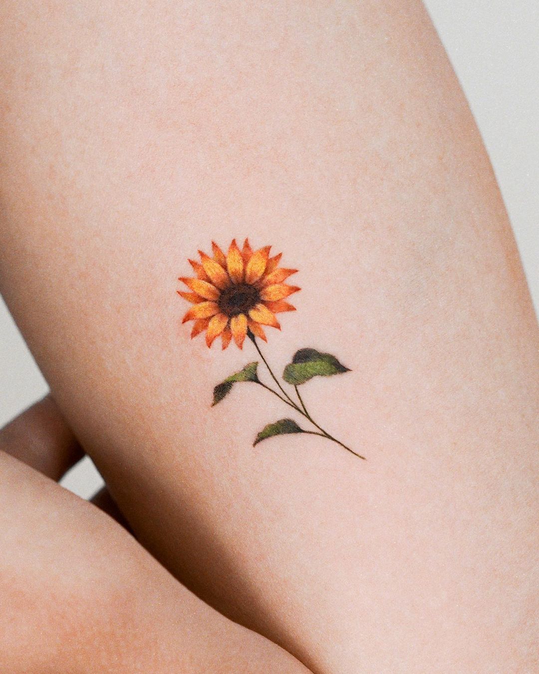 Tiny Sunflower Tattoo on Arm
