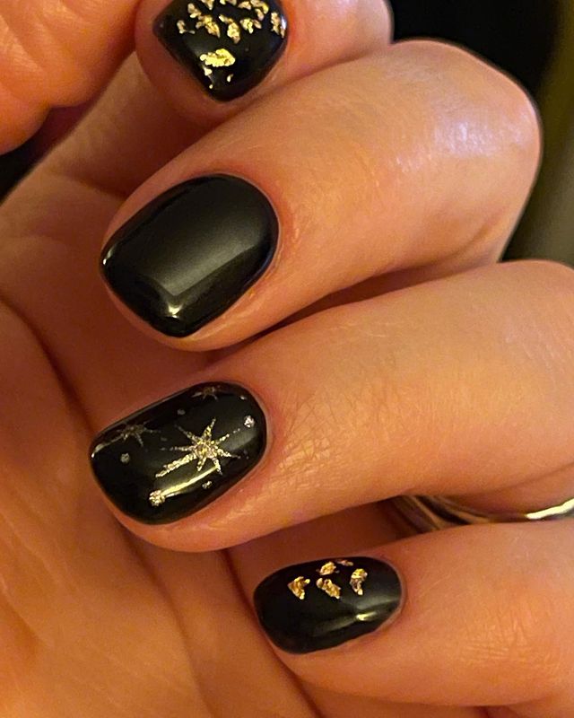Elegant Black and Gold Christmas Nails