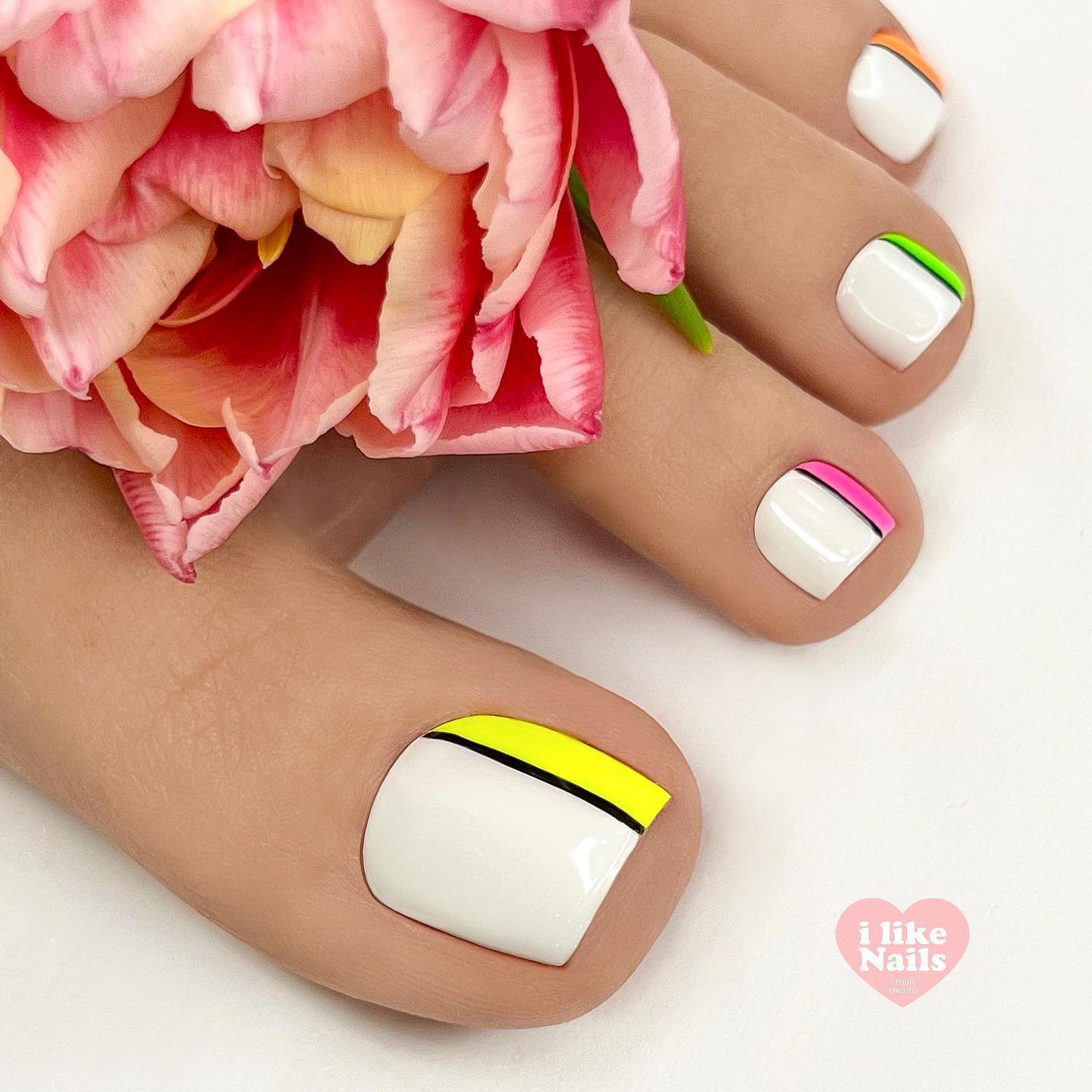 White Pedicure with Colorful Lines