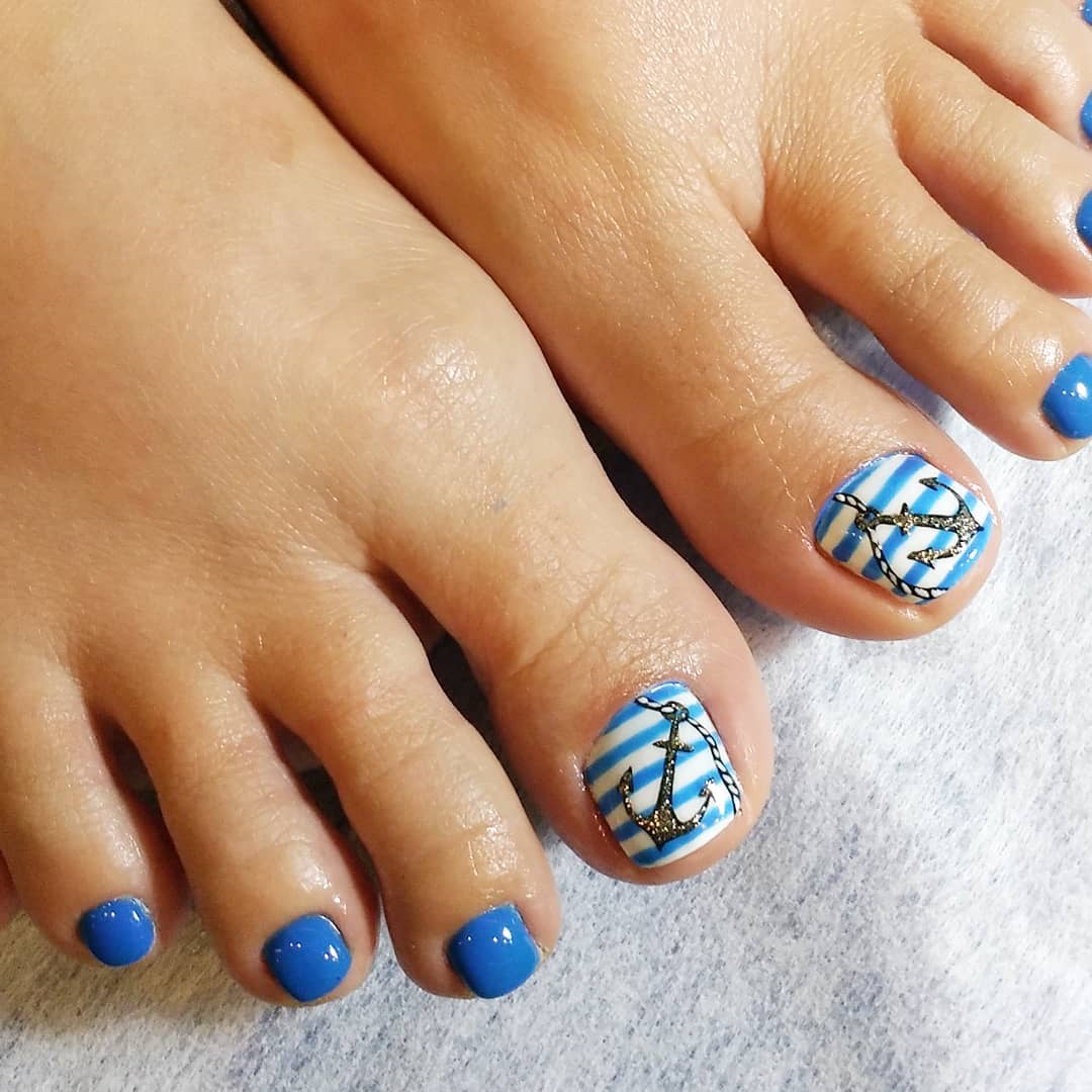 Light Blue and White Nautical Toe Nails with Anchor Design