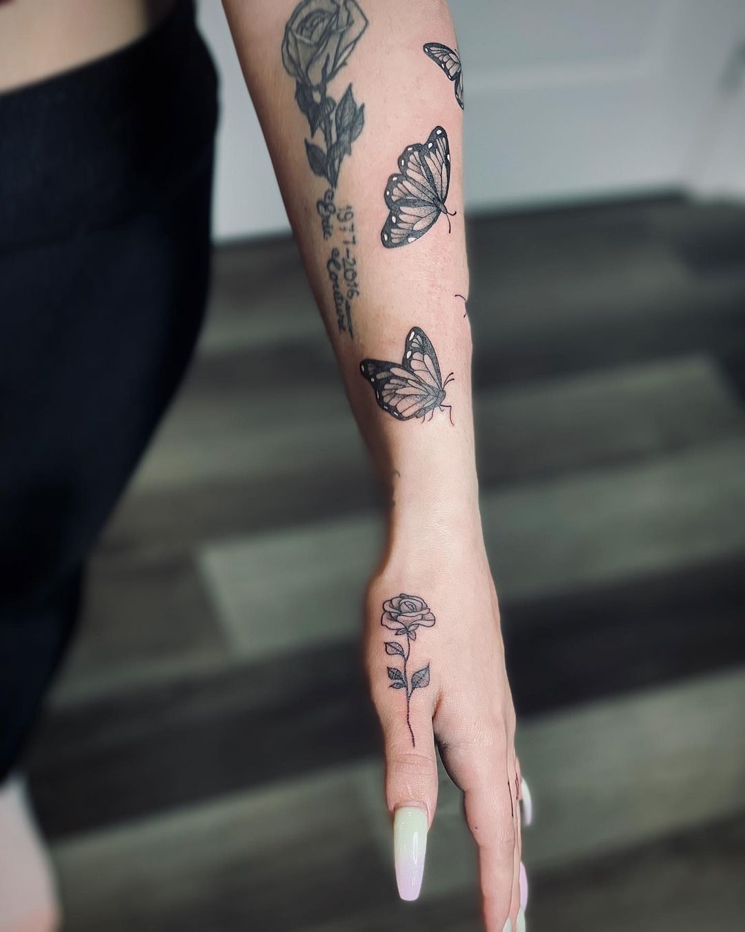 Black Rose Tattoo on Thumb