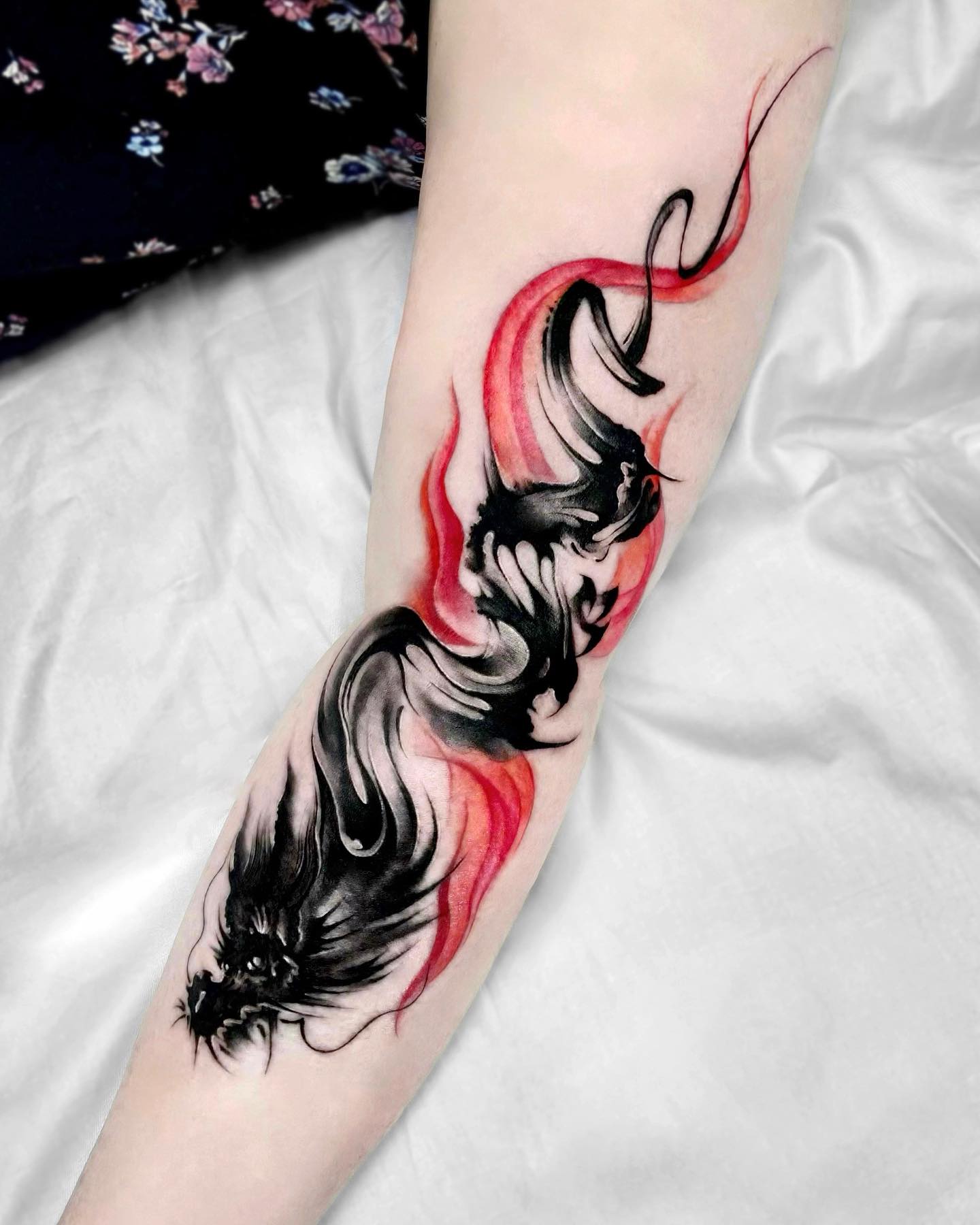 Black and Red Dragon Tattoo on Arm