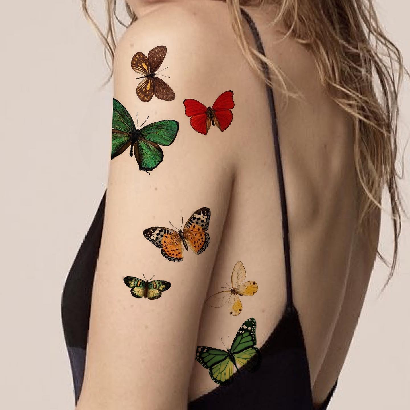 Colorful Butterfly Tattoos on Arm and Side
