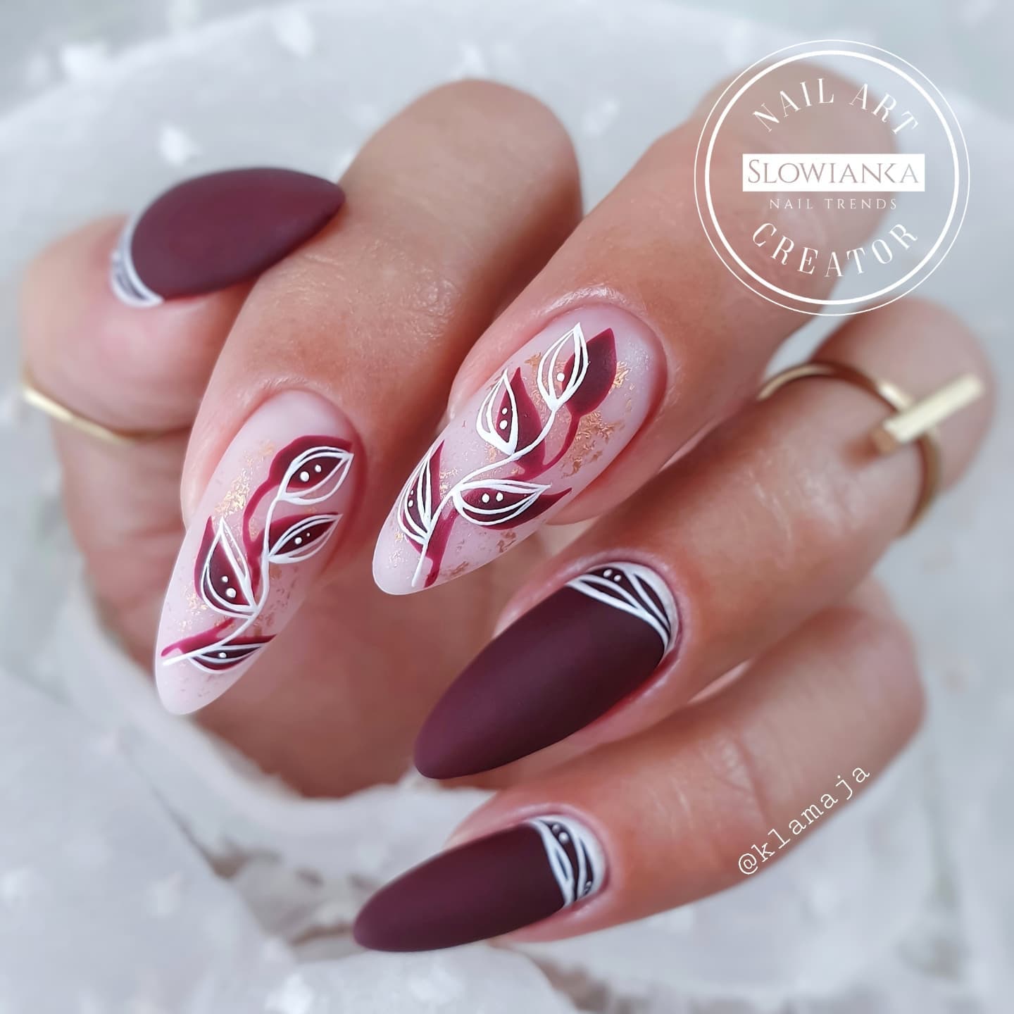 Long Matte Burgundy Nails with Leaf Design