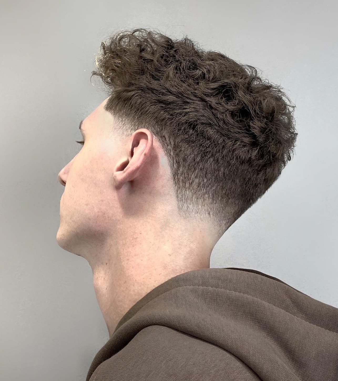 Taper Haircut on Light Rown Curly Hair