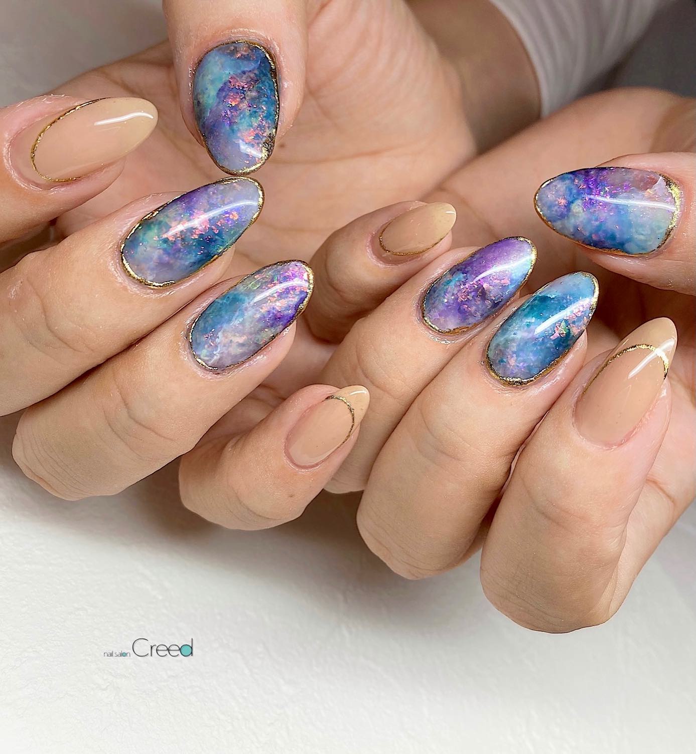 Round Pastel Opal Nails with Gold Lines