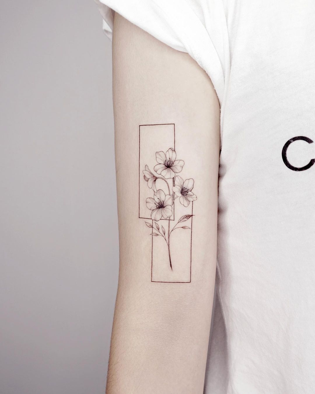 Black and White Flower in Rectangle Tattoo on Arm