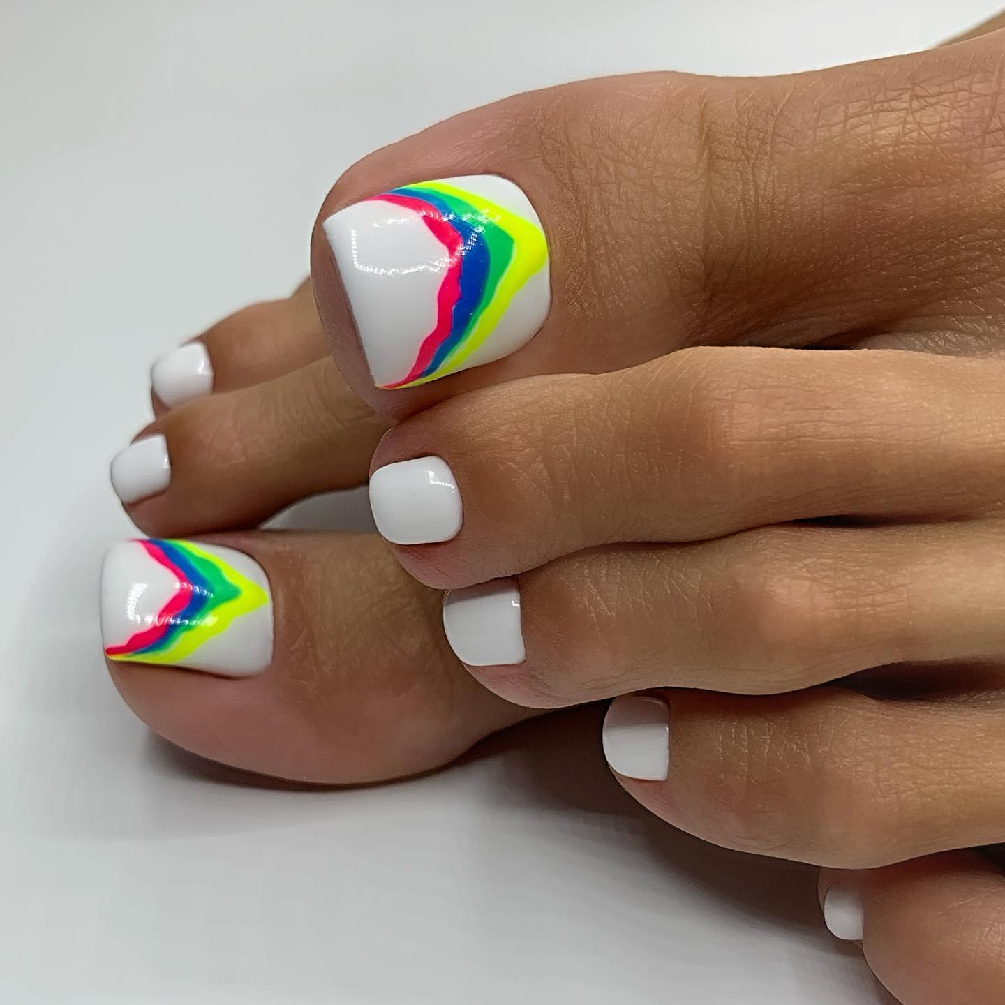 White Gloss Pedicure with Rainbow Lines on Big Toes