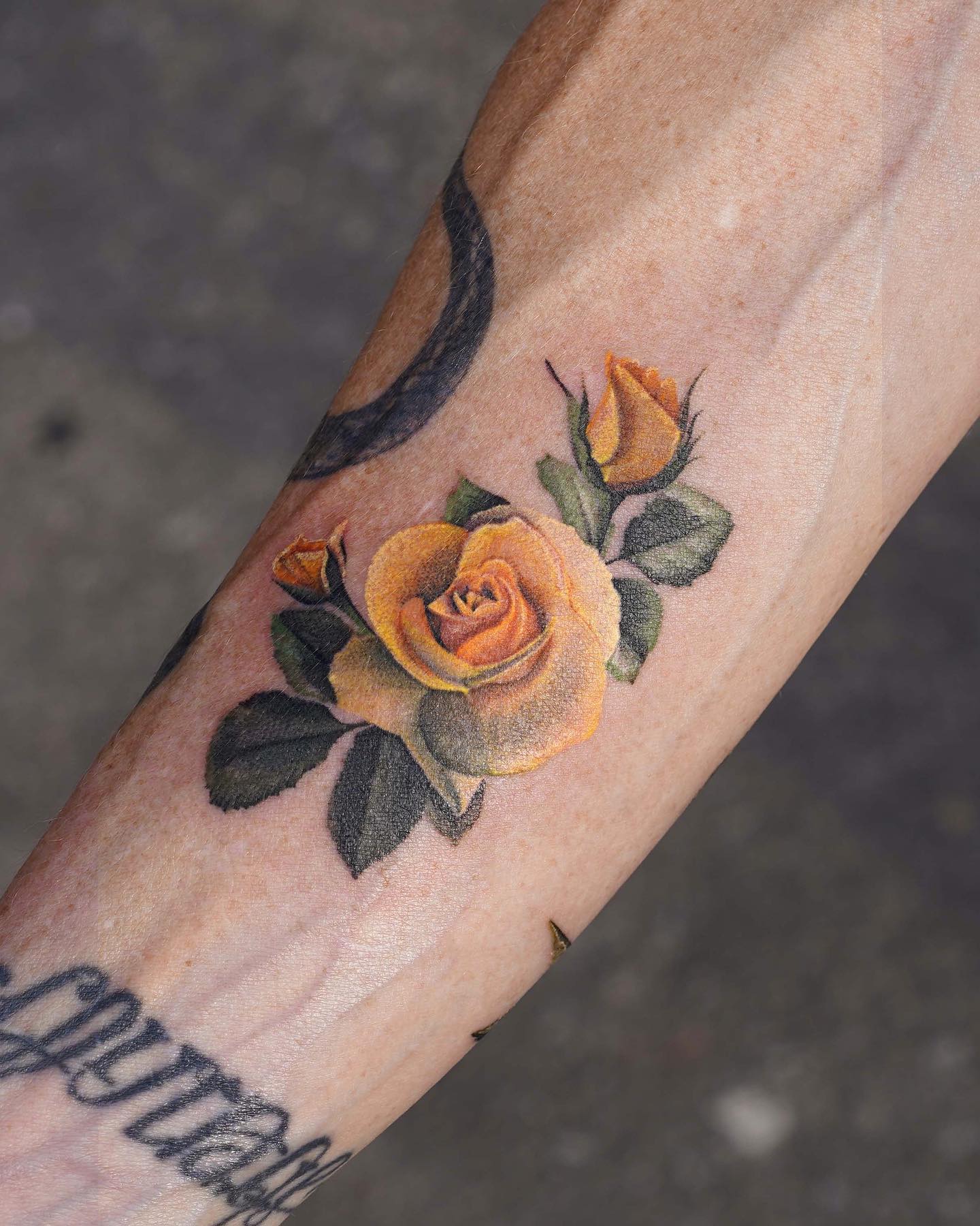 Small Gold Rose Tattoo on Arm