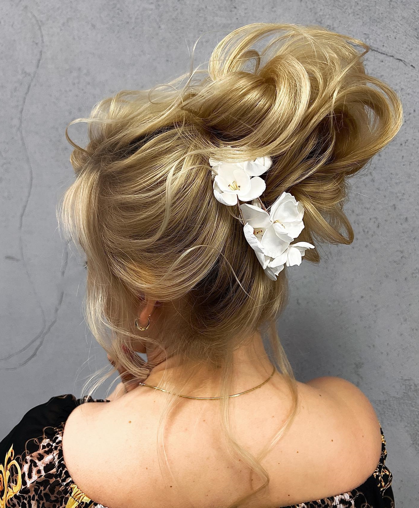 Blonde Wedding Updo Hairstyle with Floral Decor