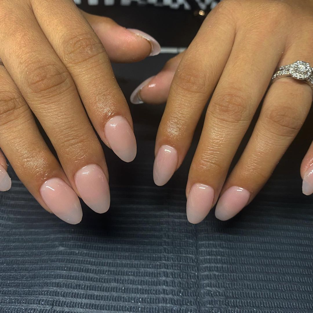 Nude almond nail art with accents