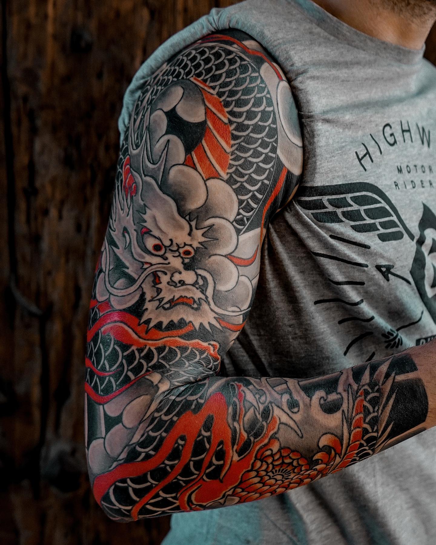 Traditional Black and Red Tattoo on Arm