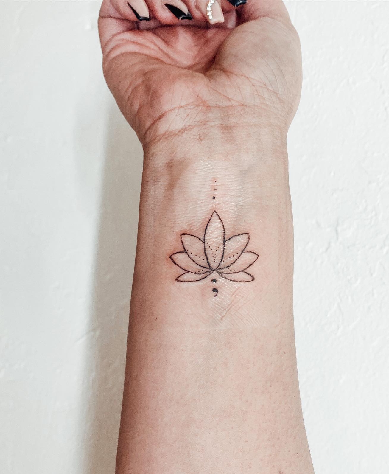 Lotus Semicolon Tattoo on Wrist