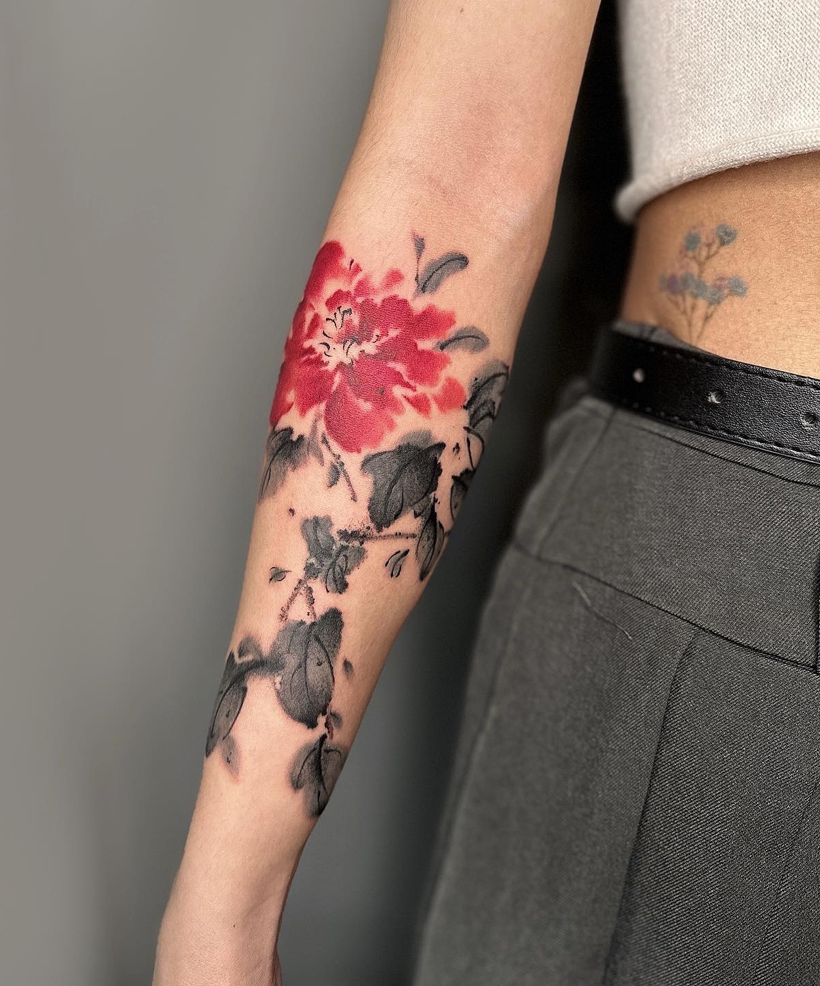 Red and Black Chinese Flower Tattoo on Arm