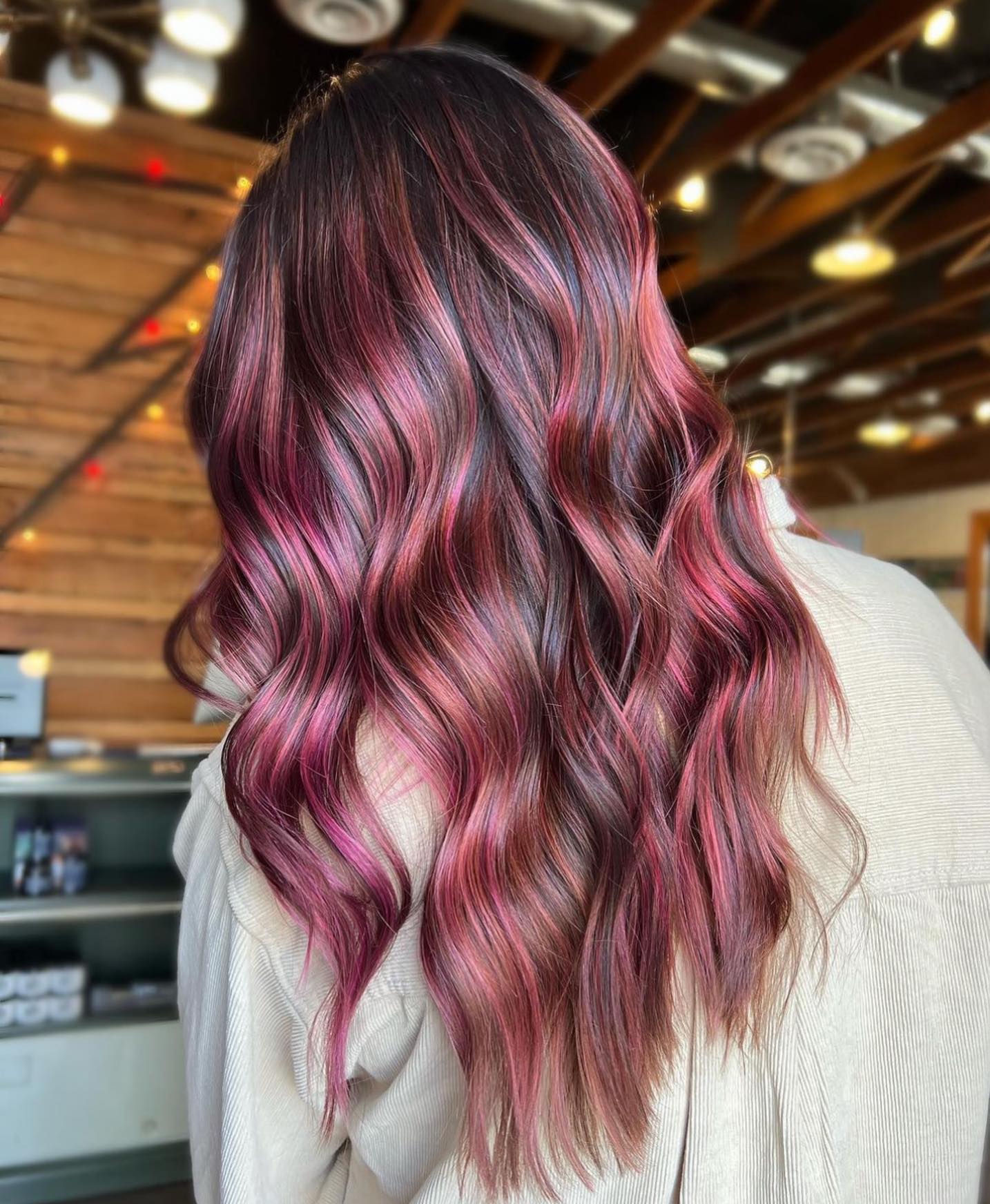 Reddish Pink Highlights on Long Wavy Hair
