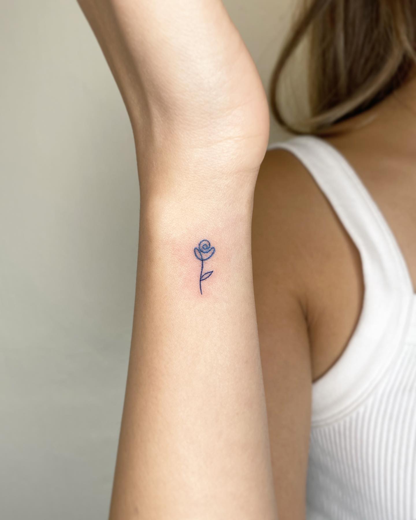 Tiny Rose Tattoo on Wrist