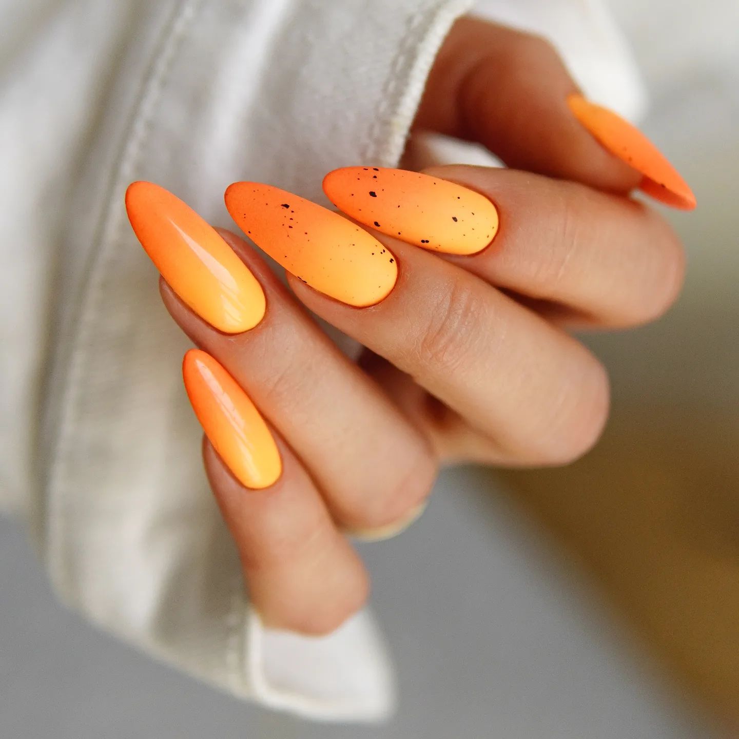 Yellow to Orange Ombre Nails with Black Spots