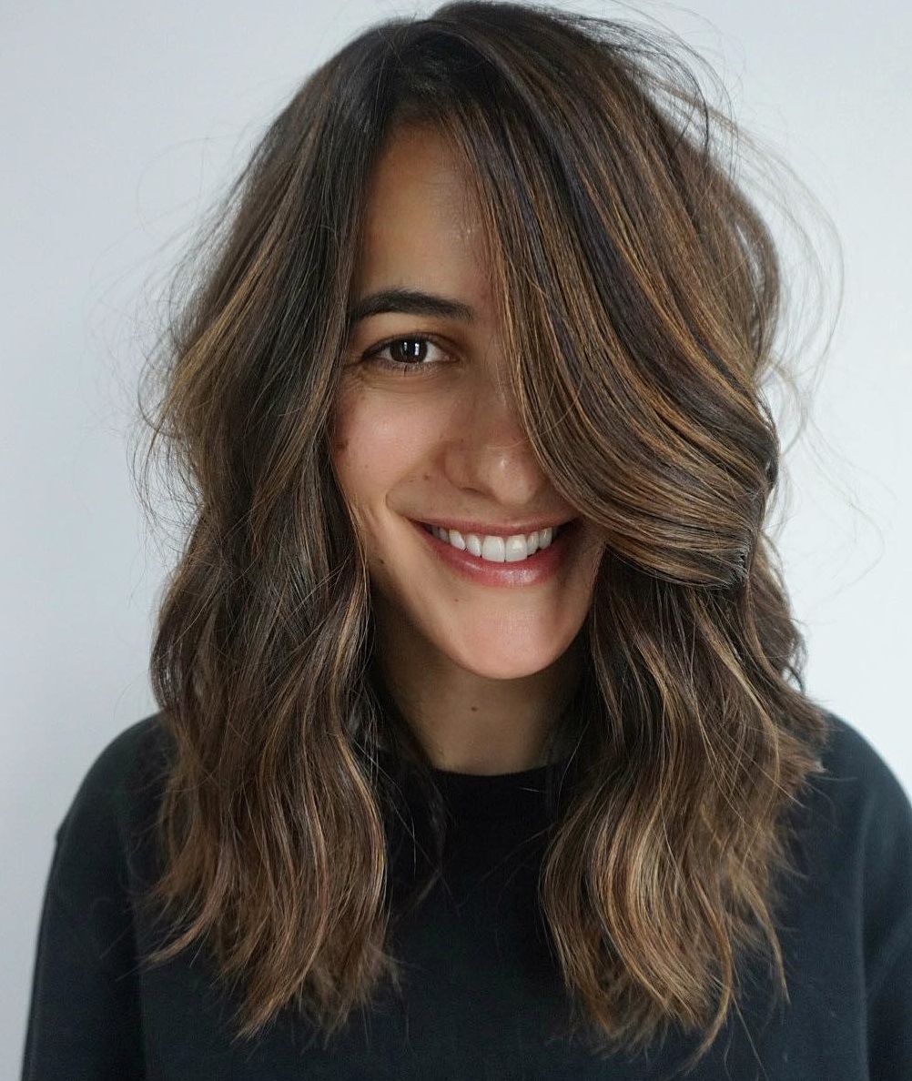 Image of Wavy side-parted hairstyle for long narrow face