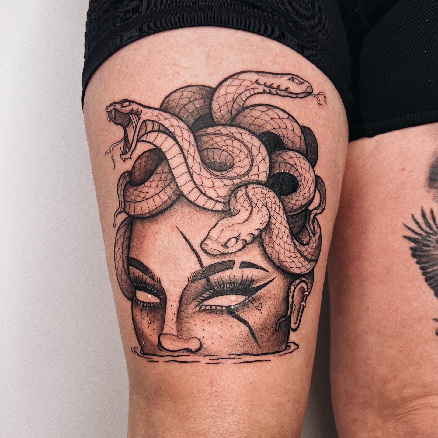 Black Medusa Tattoo on Thigh