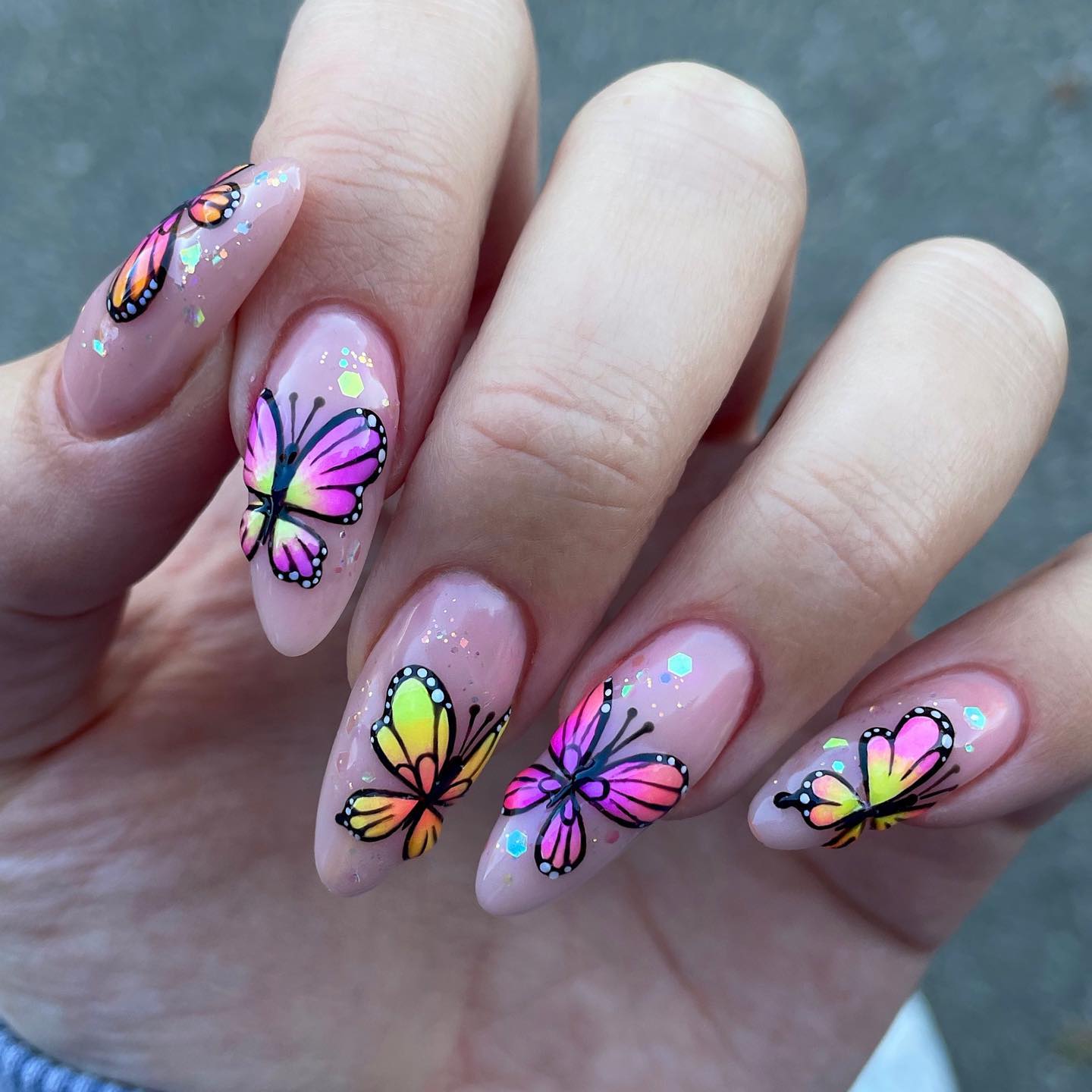 Nude Almond Nails with Colorful Butterflies