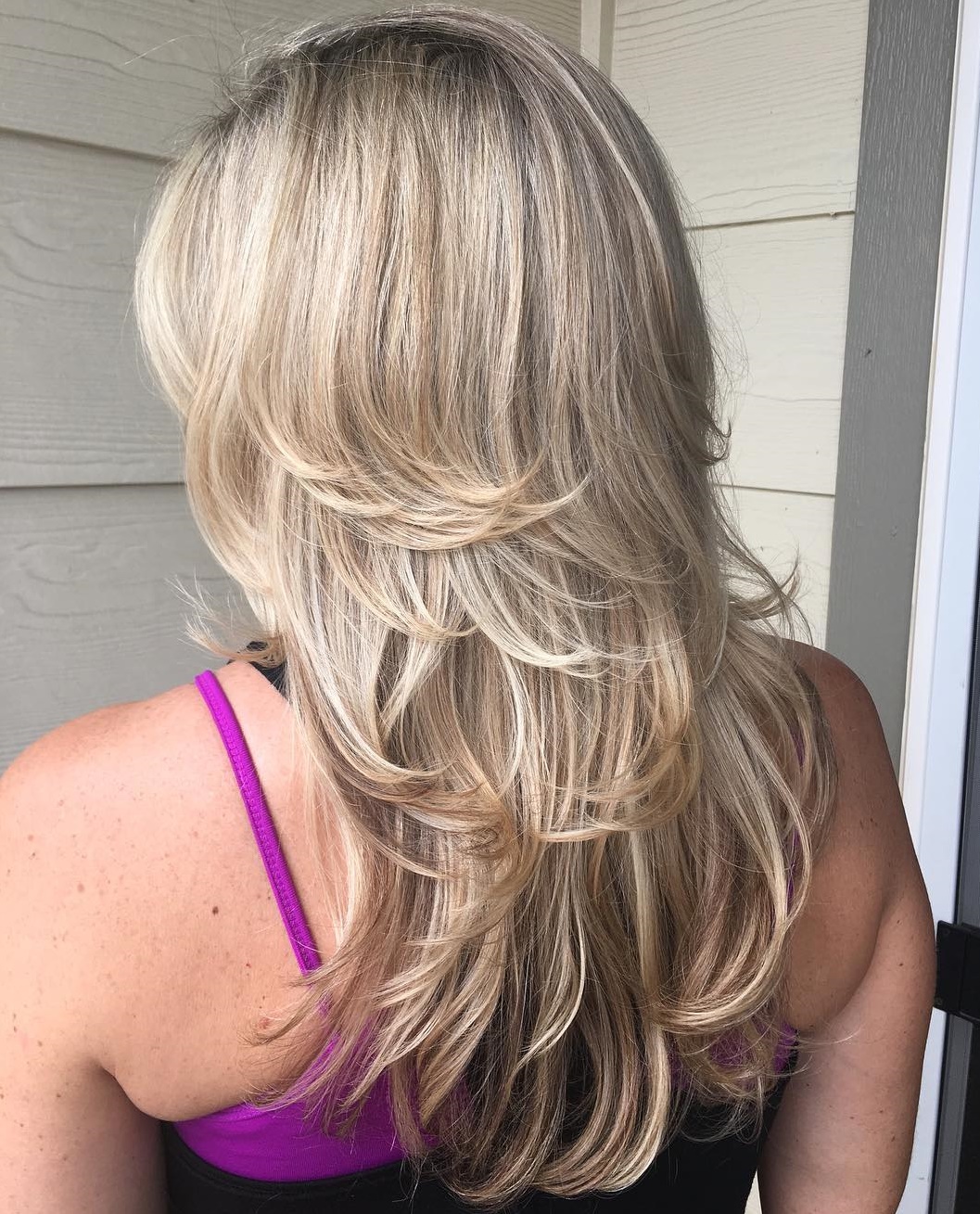Long Feathered Sandy Blonde Hairstyle