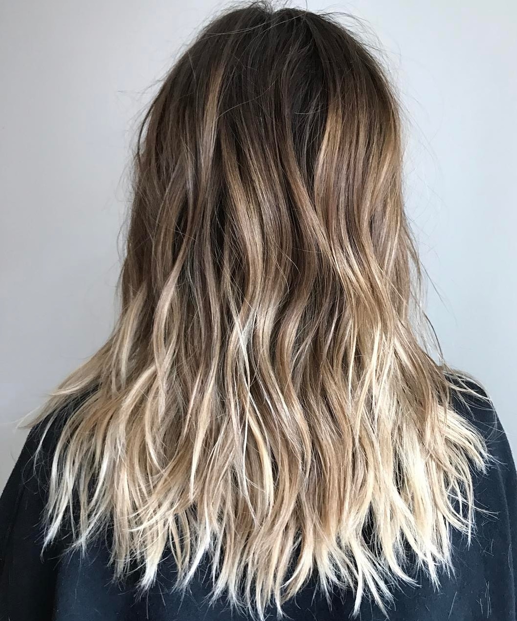 Long Sliced Cut With Blonde Ombre