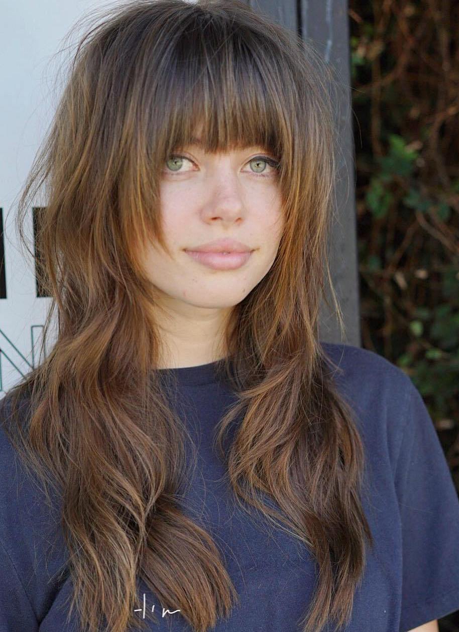 Long Haircut With Layers And Arched Bangs