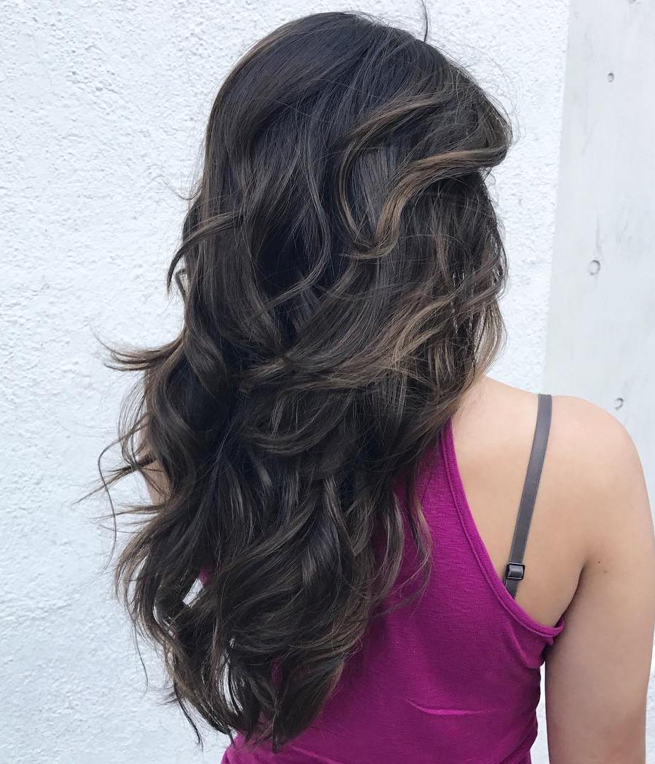 Brunette Wavy Layered Hairstyle For Long Hair