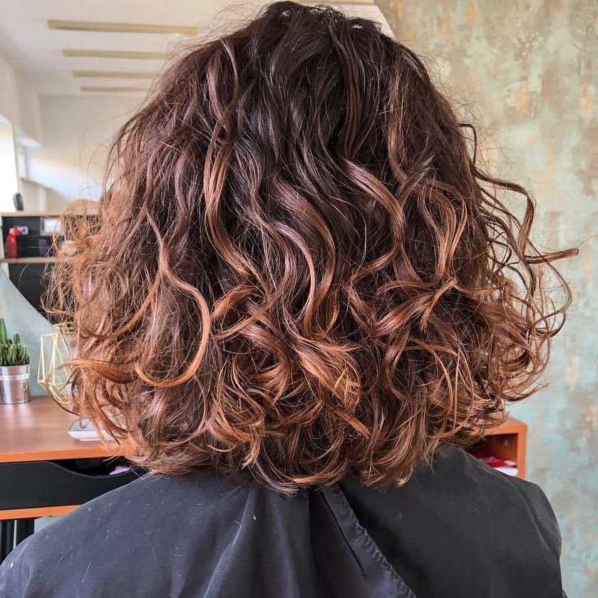 Brown Curly Bob With Rosewood Balayage