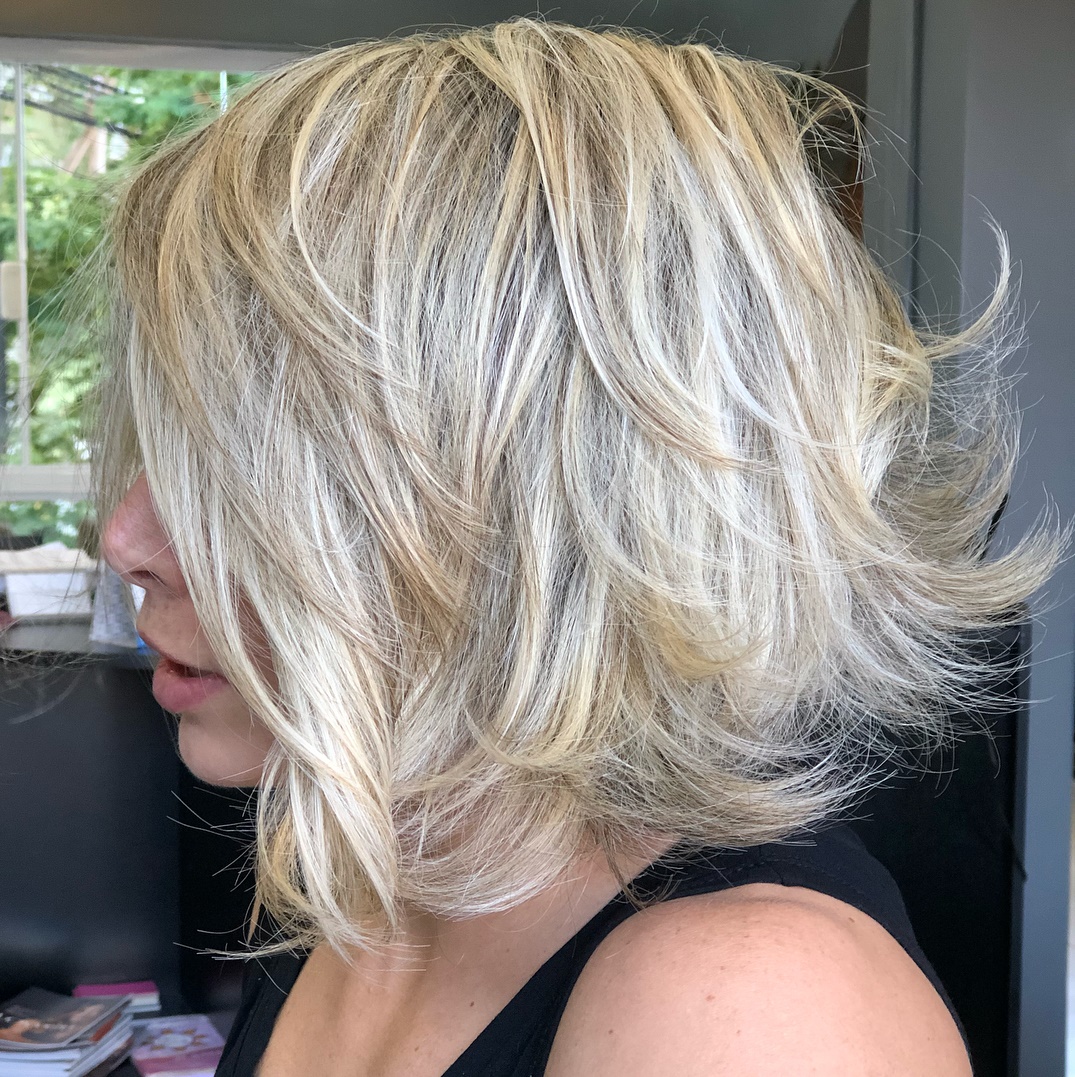 White Blonde Feathered Lob Hairstyle